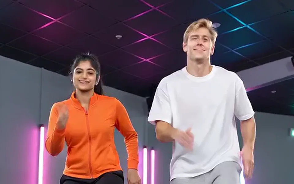 Frame from our demo: two people dancing under neon lights (dance effect demo).